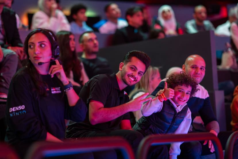 Photo of fans smiling to the camera
