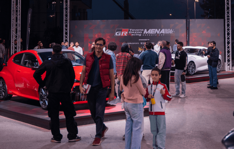 Photo of the showroom with cars and visitors